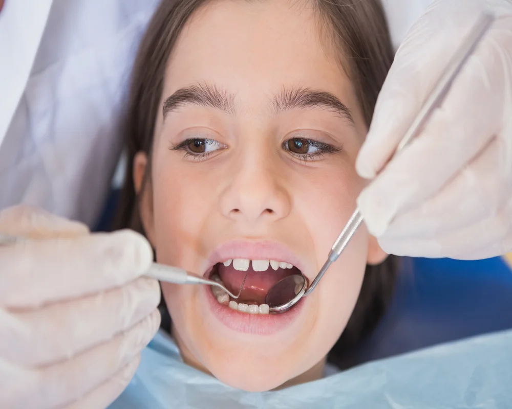 Child receiving gentle pediatric dental care at MiNa Family Dentistry Thornhill